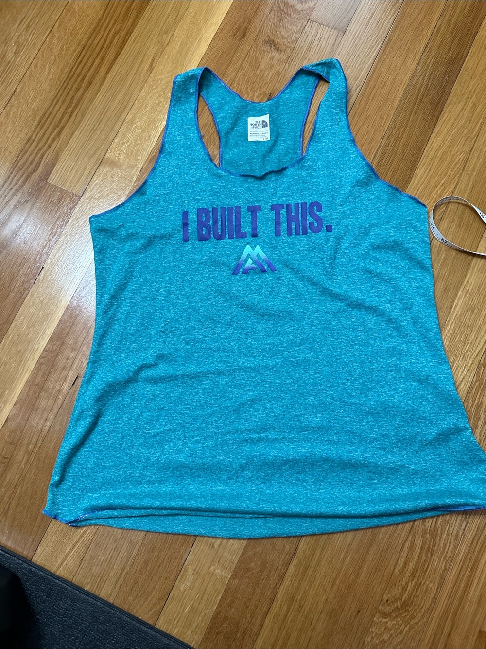 The North Face Teal Racerback Tank with 'I BUILT THIS.' Graphic
